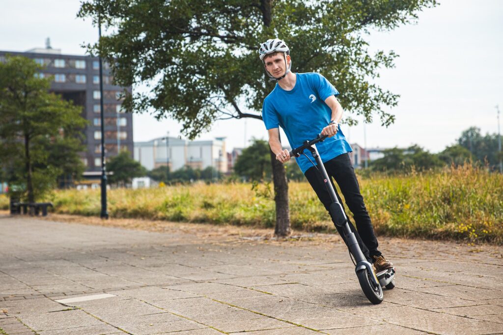 Ginger e-scooter leaning over