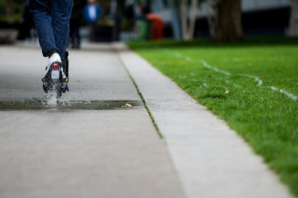 Tier Four electric scooter through puddle